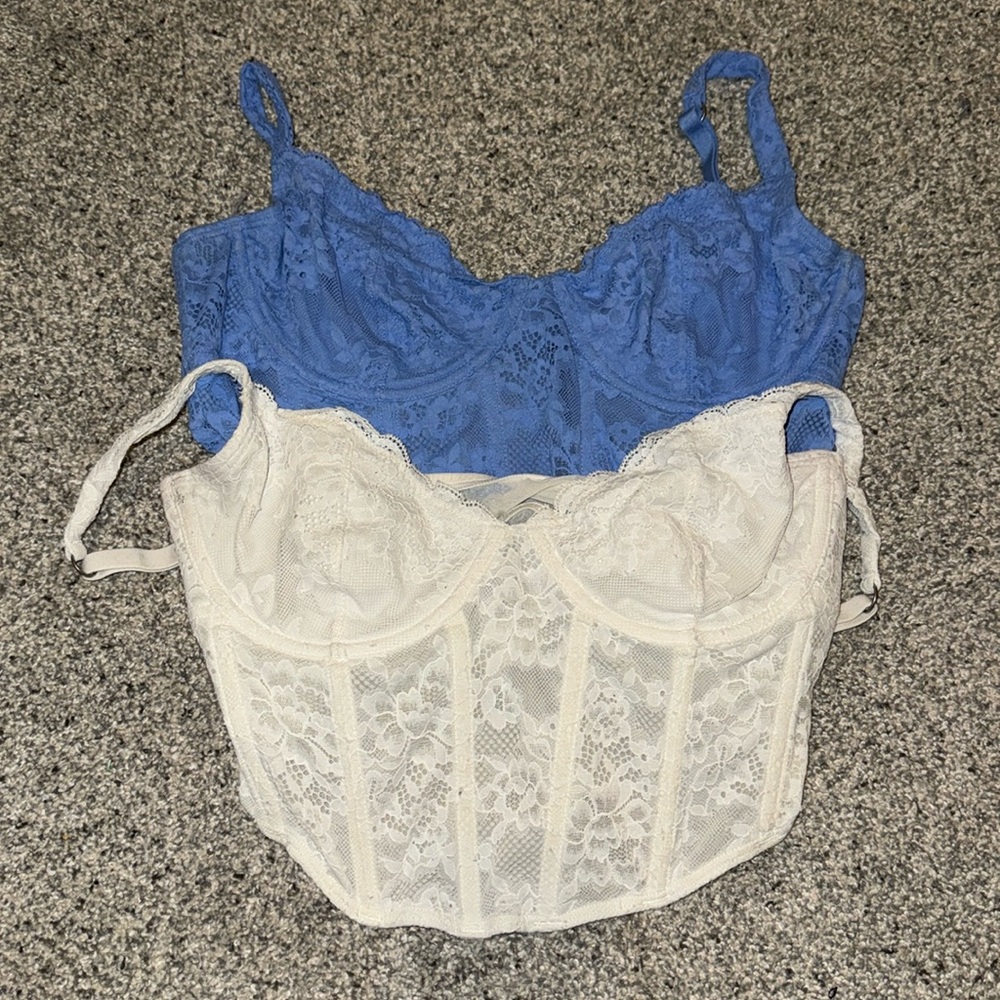 Two lace corset tops (blue and white) from Gilly Hicks. SIZE MEDIUM